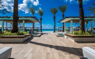 Cayman Islands resort with ocean view and palm tress