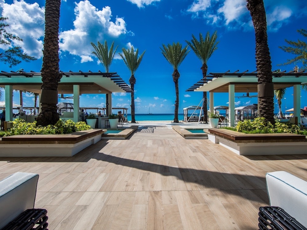 Cayman Islands resort with ocean view and palm tress