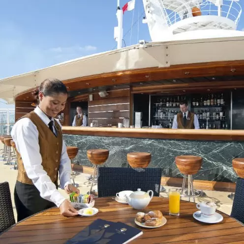 Waiter serving food on deck MSC Cruises