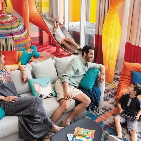 royalCaribbean_Symphony-ultimate-family-suite-couch-living-room