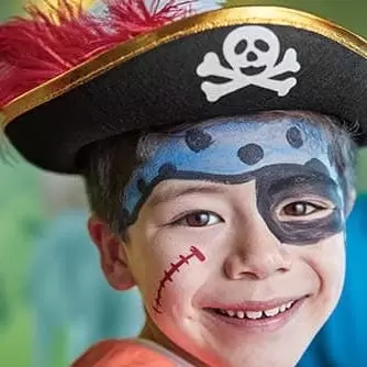 kid with pirate hat and facepaint